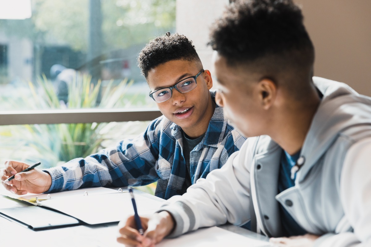 Two students talking through a disagreement